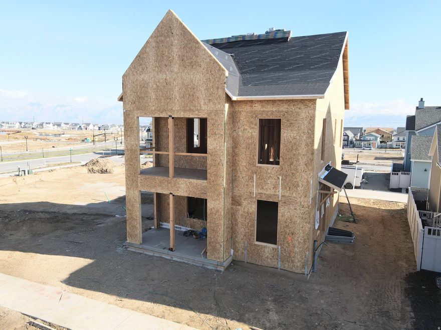 Brand new home just started construction, of this modern design home! Step inside to discover 9-ft ceilings on every level, creating a bright and open atmosphere throughout. The main level features a dedicated office or bedroom ideal for remote work or study, and flows seamlessly into an upgraded kitchen complete with high-end finishes perfect for both everyday living and entertaining. Upstairs, the spacious primary suite includes a private balcony. Large windows throughout fill the home with natural light, enhancing the open spaces of this thoughtfully designed layout. Located in the desirable Watermark Village in Daybreak community, you'll enjoy access to parks, trails, and the Watercourse all just minutes away. Estimated Summer 2026 Completion. *Interior finished photos are of a previously built home of a similar floor plan for example purposes. Upgrades and finishes will vary*