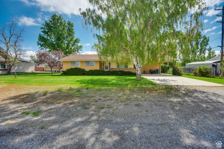 Discover your dream home nestled in a serene neighborhood! This spacious 5-bedroom, 3-bath residence offers the perfect blend of comfort and outdoor living. Enjoy the beauty of mature landscaping that surrounds the property, providing both privacy and picturesque views. Step outside to your expansive backyard, ideal for entertaining or simply relaxing in the tranquility of nature. The generous patio is perfect for summer BBQs and family gatherings. Plus, with ample extra storage space, you'll have all the room you need for your belongings.