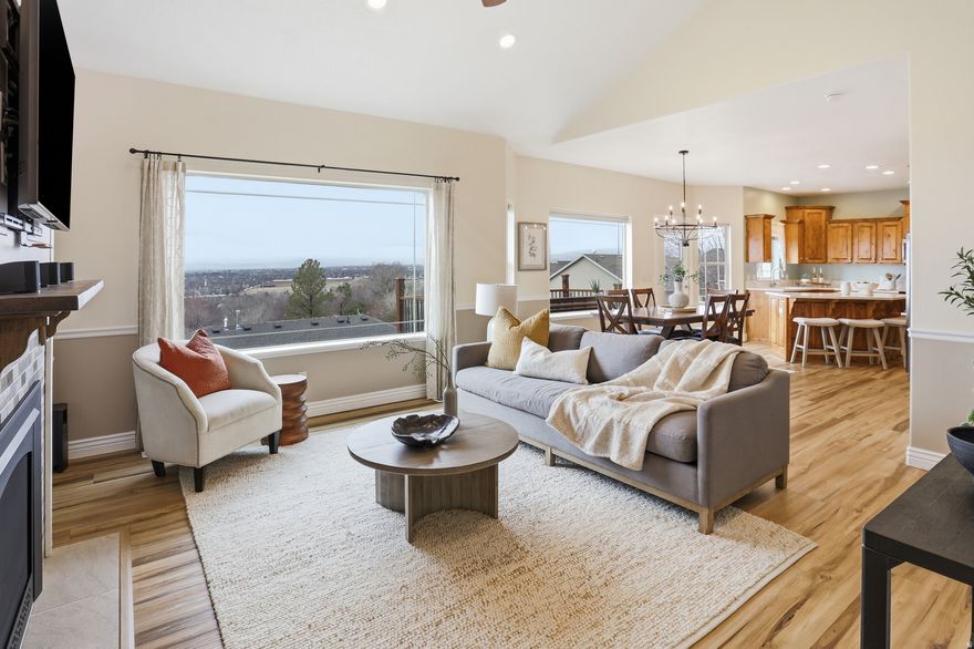 Avanyu Acres sits along the base of Mahogany Mountain within a private gated community in Cedar Hills overlooking Utah Valley. This exceptional rambler is positioned to capture unobstructed scenery of Utah Lake, the valley, and the surrounding mountains. The front porch welcomes you with mountain backdrops, while the rear of the home unfolds into expansive lake and valley panoramas that stretch as far as the eye can see. Filled with natural light throughout, this five-bedroom, five-bathroom residence has been lovingly cared for and thoughtfully updated over the years, with newer paint, flooring, ambient lighting, security cameras, and upgraded mechanical systems including newer HVAC and water heaters. The main level is designed for effortless single-level living. Kitchen features several floor to ceiling built in pantry cabinets, Quartz countertops, and double oven electric range. A spacious primary suite with a walk-in closet and ensuite with double vanity and walk-in shower, along with generous living spaces are framed by expansive windows that bring the outdoors in.The daylight walk-out basement offers remarkable flexibility and functions as a complete secondary living space with its own private entrance, full kitchen, living area, laundry, full bathroom, and a bedroom with double closets making it ideal for multi-generational living, long-term guests, or future rental potential. The basement also includes a large family room that could easily be converted into a sixth bedroom. Storage is abundant with an oversized garage that includes a massive storage area above, cold storage in the basement, and an exterior attached shed with electrical. Outside, the home continues to impress with a new RV pad complete with 30-amp hookup and black tank dump station, beautifully maintained grounds with garden boxes, and large deck outside the main kitchen designed for both functionality and taking in all the views. The gated community itself offers a playground, pickleball court, and direct access to hiking trails, and close proximity to American Fork Canyon, Tibble Fork Reservoir, Timpanogos Cave, to name a few.  After more than two decades of meticulous care, this home stands as a true testament to pride of ownership - a one-of-a-kind property offering unforgettable views and a setting that feels both elevated and timeless. Welcome home!