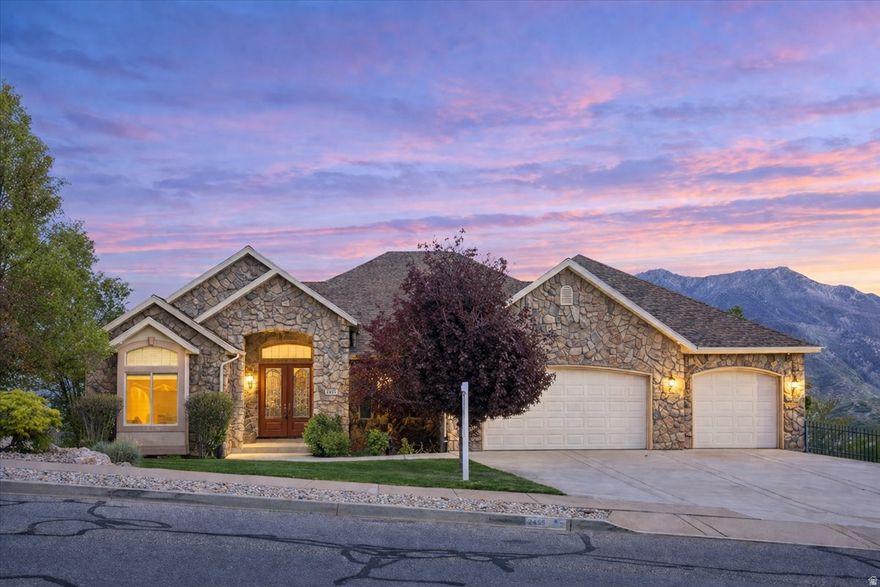 **Open House: Friday, April 17 from 5:007:00 PM & Saturday, April 18 from 11:00 AM1:00 PM** Tucked into a peaceful Layton setting, this 6-bedroom, 4-bath home offers 4,960 sq ft of thoughtfully designed living space-blending comfort, functionality, and elevated finishes throughout.  The main level features an open, light-filled layout with a cozy fireplace in the front living room and expansive windows that capture the surrounding views. Just off the kitchen, a private deck creates the perfect space to relax or entertain while taking in the scenery. The kitchen is a true highlight, equipped with a Viking 6-burner cooktop with built-in griddle, pot filler, trash compactor, and ample storage, including unique built-in details.  The primary suite offers a luxurious retreat with heated floors in both the bedroom and bathroom, dual fireplaces with blowers, and a spa-like bathroom featuring a steam shower-designed for both comfort and relaxation.  The fully finished walkout basement adds incredible versatility with a second living space, additional fireplace, basement kitchen area, and direct garage access-ideal for guests, multi-generational living, or flexible use. Abundant storage can be found throughout the home.  Outside, enjoy a serene setting with frequent wildlife, including deer, rabbits, and wild turkeys, creating a peaceful, private feel.  Car enthusiasts and hobbyists will appreciate the rare 7-car garage configuration with garages on multiple levels, offering exceptional space and convenience.  Recent updates include tandem water heaters (2025), professionally cleaned air ducts (2025), heat tape installed on the roof, a newer upstairs furnace, and a water softener (approx. 2016)  Tucked into a peaceful Layton setting, this 6-bedroom, 4-bath home offers 4,960 sq ft of thoughtfully designed living space-blending comfort, functionality, and elevated finishes throughout.  The main level features an open, light-filled layout with a cozy fireplace in the front living room and expansive windows that capture the surrounding views. Just off the kitchen, a private deck creates the perfect space to relax or entertain while taking in the scenery. The kitchen is a true highlight, equipped with a Viking 6-burner cooktop with built-in griddle, pot filler, trash compactor, and ample storage, including unique built-in details.  The primary suite offers a luxurious retreat with heated floors in both the bedroom and bathroom, dual fireplaces with blowers, and a spa-like bathroom featuring a steam shower-designed for both comfort and relaxation.  The fully finished walkout basement adds incredible versatility with a second living space, additional fireplace, basement kitchen area, and direct garage access-ideal for guests, multi-generational living, or flexible use. Abundant storage can be found throughout the home.  Outside, enjoy a serene setting with frequent wildlife, including deer, rabbits, and wild turkeys, creating a peaceful, private feel.  Car enthusiasts and hobbyists will appreciate the rare 7-car garage configuration with garages on multiple levels, offering exceptional space and convenience.  Recent updates include tandem water heaters (2025), professionally cleaned air ducts (2025), heat tape installed on the roof, a newer upstairs furnace, and a water softener (approx. 2016).  Virtually Tour this Home! Ask your agent for the link.
