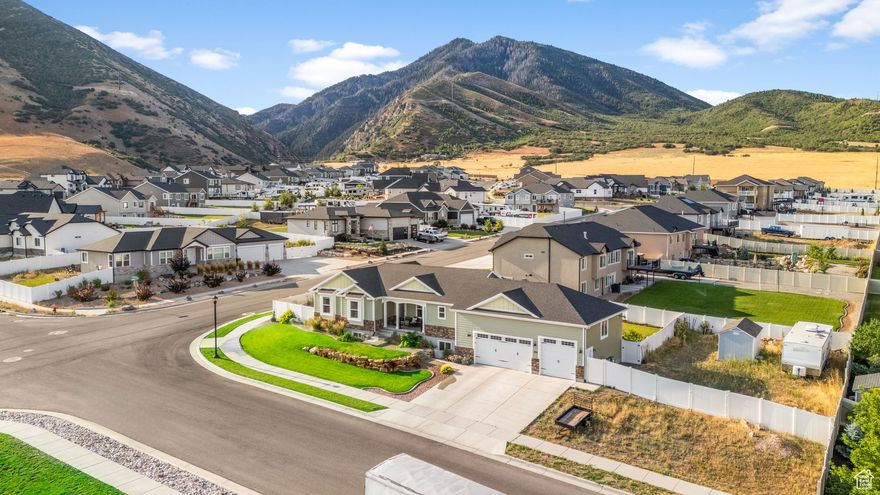 Remarkable! Magnificent views of the Great Salt Lake and Oquirrh Mountains that you'll never tire of. Terraced backyard with 2 patios, 1 covered & 1 open, & a covered deck for entertaining. And, if you want more adventurous entertainment you can access your RVs and toys in this home's fully fenced, secure RV area with a shed to store your gear. Sit on the covered porch, soak in the views, live remarkably!