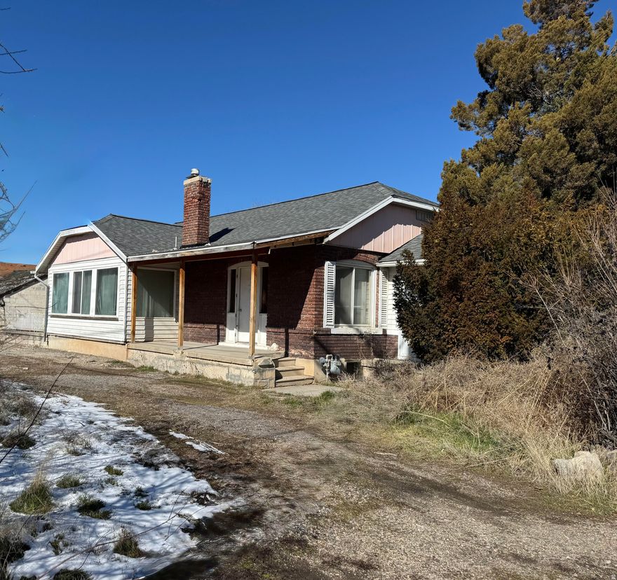 Estate Sale  Investor Opportunity in Magna! Located in the heart of Magna, this property presents a prime opportunity for investors or those looking for redevelopment potential. The roof was replaced in 2020, and the home sits on a large, deep .27-acre lot. Zoned R-2 (6.5), allowing for single-family or duplex use. Additional parcel #14-20-378-012 is included in the sale. Seller has never occupied the property and has limited knowledge of its condition. Property is being sold as-is. No seller repairs will be made. No blind offers. Do not enter outbuilding due to safety concerns. Agent is related to seller. Square footage is provided as a courtesy estimate based on county records. Buyers are encouraged to obtain an independent measurement.