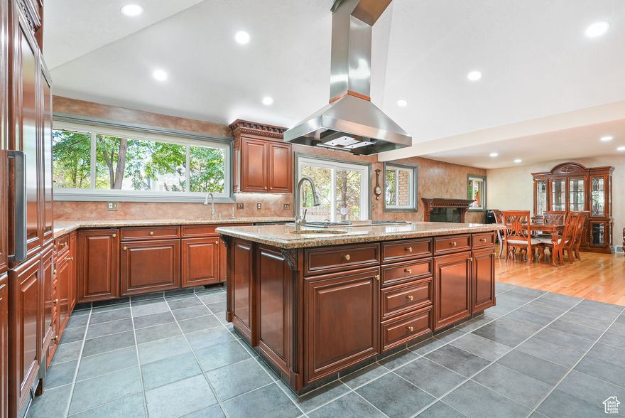 LOCATION, LOCATION, LOCATION!!  Right on Creek Road where you never worry about the roads not being plowed or missing a day of work or skiing!   This gorgeous home, nestled in the highly sought-after Cottonwood Heights community, is a stunning 4,731 sq. ft. home, which blends mountain-inspired convenience with refined elegance-just minutes from world-class ski resorts.  The gourmet kitchen is a chef's dream, featuring cabinet lighting, pull-outs, soft-close cabinetry, instant hot water, filtering system, and a high-end refrigerator. A custom railing crafted by renowned artist Cordell Taylor adds a touch of artistry to the open, airy layout.  Step inside from the garage to find a dedicated ski locker and custom cabinetry-perfect for storing your gear after a day on the slopes. The main floor offers a spacious primary suite and a conveniently located laundry room, making everyday living a breeze.  With 4 bedrooms and 3.5 bathrooms, there's plenty of room for family and guests. The finished basement includes a unique bonus-a fully equipped hair salon with its own private exterior entrance, providing endless possibilities for a home business, guest suite, or creative space.  Whether you're entertaining after a powder day or simply enjoying the peace and beauty of Cottonwood Heights, this home offers the perfect blend of luxury, function, and location.