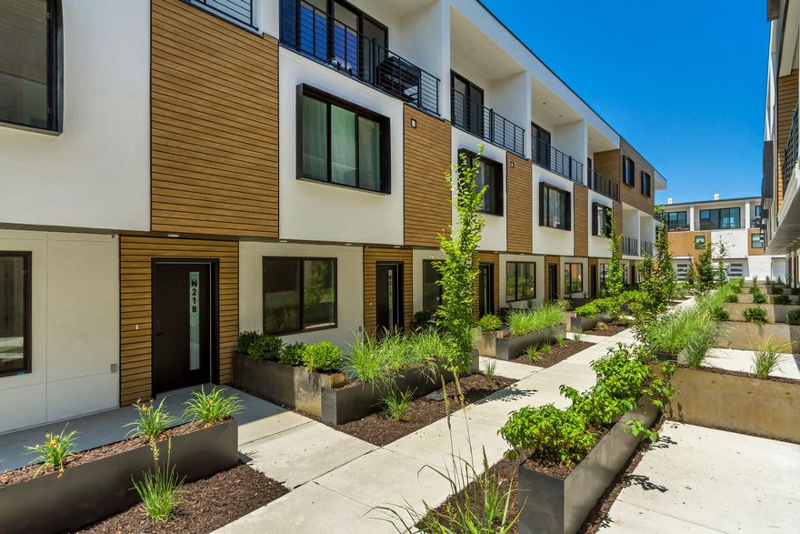 FOR THE OPEN HOUSE, PLEASE COME TO THE MODEL LOCATED AT UNIT B104. Welcome to Opus Green. Experience the perfect harmony of modern comfort and environmental stewardship. Opus Green Townhomes offer a range of floor plans, including 2- and 3-bedroom townhomes, designed with meticulous attention to detail. From the spacious great rooms and gourmet kitchens to the tiled bathrooms and open stair railings, every aspect of Opus Green exudes sophistication and elegance for your comfort. This modern townhome community is all-electric with 9'7" cathedral ceilings, tiled showers and tubs with glass doors. Best in class, Pella windows, ductless, wall-mounted mini split air conditioners and heat pumps. Quartz countertops and a one of a kind floorplan not seen before. This end unit 3 bed 3.5 bathroom oasis will leave you green with envy. The 2 car garage with EV charging station, 1 touch smart home temperature control app and package storage/delivery service "Fetch Package", are just a few more added benefits to this zero emission environmental living townhome. Embrace a life of unparalleled comfort, elegance and fulfillment in the dwelling you've been longing for. Please navigate to our model at 4186 S Main Street, B #104, Millcreek UT 84107 for details and to gain access to unit M315