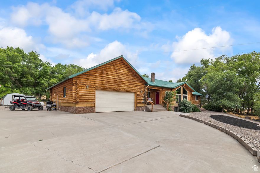 Beautiful, updated home! Quiet location in the foothills. Peaceful views. Three acres of land is nearly untouched with plenty of frontage. Water sources include culinary and an underground well. Surrounding the home are large, mature trees and an ephemeral stream. Large back patio for outdoor living. A fully-equipped dome greenhouse (Growing Spaces brand) has newly taped seams and is included in the sale. Exterior log siding is newly refinished. Enjoy a vaulted, open living area and a chef's kitchen with granite countertops and new appliances. Roomy interior. Large, flexible rooms and remodeled bathrooms. Raised, daylight basement with a separate entrance and kitchenette. Multi-generational living or rental income potential. Three wood-burning stoves add warmth and charm.