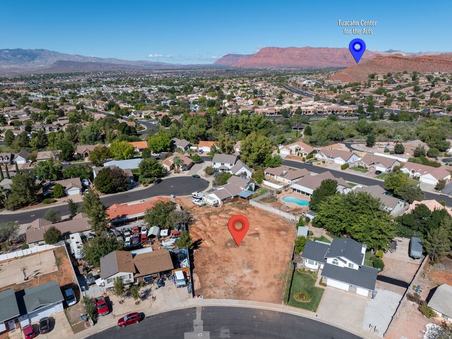 Nearly Half-Acre Lot with Trail Access and No HOA! Build your custom home on this .40-acre homesite just under 10 minutes from downtown St. George, Snow Canyon State Park, and Tuacahn Amphitheatre. Tucked off a low-traffic street and surrounded by established homes with block walls on both sides, the setting feels quiet and settled. Step out your front door and connect directly to St. George's paved trail system just a minute away. Golf, mountain biking, and hiking are all close by. With no HOA or dues, you have the freedom to design and build exactly what you want, while still being close to everything that makes Southern Utah such a great place to live.
