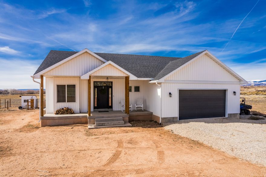 Enjoy the peace and quiet of country living while still being close enough to town to appreciate that small-town feel. Take in the wide-open skies, stunning starry nights, and frequent visits from local wildlife including deer, elk, geese, and more - all right outside your door. This custom-built home is filled with natural light and showcases beautiful, one-of-a-kind finishes you simply won't find elsewhere. Thoughtfully designed with character and charm, it offers a warm and welcoming space to call home. With acreage, included water shares, and a clean slate to make it your own, the possibilities here are endless. Create your personal paradise, start a hobby farm, or explore future property division potential. Opportunities like this don't come around often - space, freedom, and potential all in one! Square footage per building plans. Buyer to verify all information including square footage.