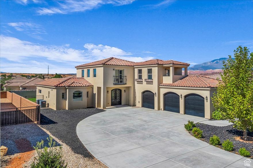 This stunning Mediterranean style home in Dixie Springs offers incredible views of Pine Valley Mountain. The spacious layout features a large primary suite with a spa inspired ensuite complete with a steam shower and vintage freestanding tub for the ultimate retreat. Upstairs, a second story deck captures the mountain vistas and provides the perfect space to relax or entertain. Thoughtful details are found throughout including an iron front door, warm pine interior doors, and a charming pergola. Modern comfort is ensured with 3 zoned units on Dixie Power.