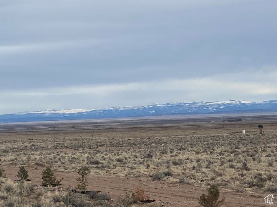 This might be the best piece of land in the Beryl/Lund area! Flat, grassy land with 1 Acre Foot of water (1945 Priority Date, #71-5760) and access via a deeded easement from the BLM. A dirt road has been cut in, making access with vehicles or a trailer very easy! Surrounded on 3 sides by either BLM or state land with 360 degree views! It is part of the SouthWest Desert Trophy Elk Unit. The property has a fence running down the west boundary and rough boundary corners are staked. Soils analysis provided in document section.