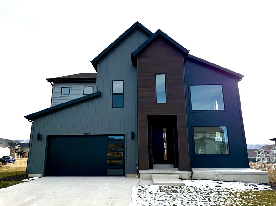 Price just REDUCED $10,000!  Builder also has some great incentives!  The Pinedale floor plan features 4 bedrooms, 3.5 bathrooms, and 3,997 total square feet. Enjoy the openness of this amazing floor plan with an abundance of natural light. The flex room, close to the entrance of the home, is ideal as an office or a formal living space. Continuing in you have a convenient powder bath located off the entry hallway. Enter the two-story great room with unstoppable light that floods from floor to ceiling windows, and flows into a spacious dining room and state-of-the-art kitchen. This includes a massive island with seating for 4 and is equipped with a gourmet kitchen and plenty of countertop space. Off the dining room, you'll find a practical mudroom that leads to your garage. Upstairs you'll find a loft space with a balcony you can take advantage of the views.  The Owner's Suite is spacious and flooded with light from all of the windows. You will also find a large walk-in closet with plenty of space. The Owner's Bath is spa-like with a walk-in shower, large vanity, natural light, and a water closet. You will also find two more bedrooms, a bathroom, and a laundry room on this upper floor. In the basement, you have even more room with a recreation room and additional bedroom and bathroom.