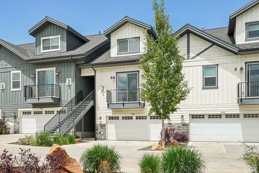 Near the pool and clubhouse sits this stunning well cared for townhouse that lives like a home! Upgrades throughout and a thoughtful, versatile floorplan includes 3 bedrooms, 3.5 bathrooms and an oversized 2 car garage that leads right to the gorgeous chef's kitchen with Bertizoni Appliances. Beautiful white cabinetry & quartz countertops throughout, expansive windows and sliding doors out to the large Concrete Patio on the back with BBQ hookup just off the main level plus a small deck off the front bring the outdoors in. Master Suite on main living level above garage and 2 spacious suites on the upper level with loft are and walk in closets. All of this just steps to trails, dining, shopping, Starbucks, bus route, neighborhood park, and more. Only minutes to Kimball Junction and Main Street Park City, and a quick commute to Salt Lake City!