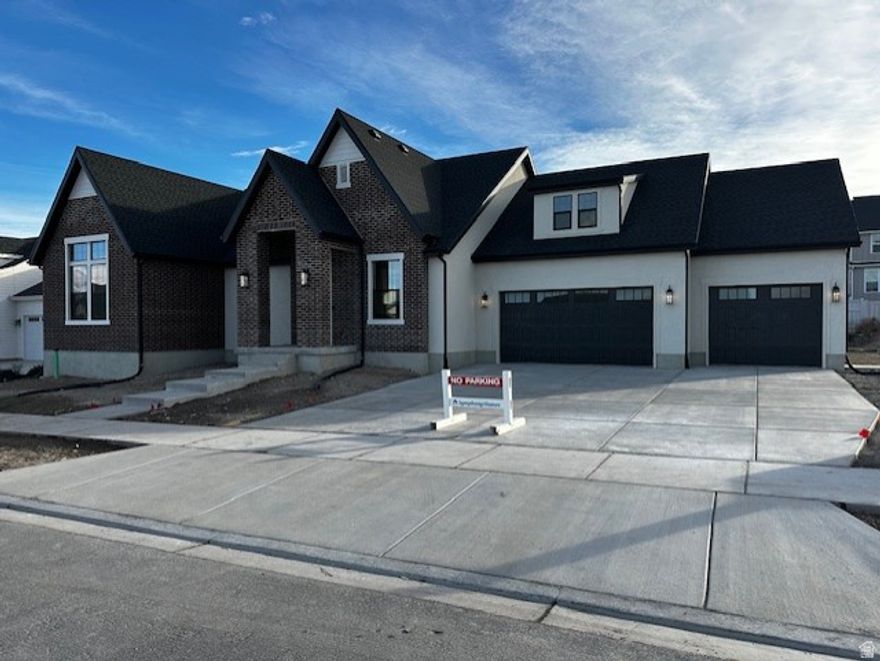 Lot 130 in Beacon Pointe, by Symphony Homes- The Roosevelt XL. This stunning rambler plan offers 2 bedrooms and 2.5 baths on the main floor, thoughtfully designed with luxury and comfort in mind. The primary suite features a spa-like bath and a spacious walk-in closet with custom built-ins. A second bedroom with its own ensuite bath, a versatile flex room, dedicated office, convenient laundry, and a covered patio make the main level both functional and elegant. The gourmet kitchen is a showstopper with high-end appliances, a butler's pantry, and designer finishes throughout.  The finished basement expands the living space with two additional ensuite bedrooms, a home gym, a sprawling family/game room complete with a wet bar, cold cellar, finished storage, and more. A radon mitigation system adds peace of mind. With exquisite interior details and thoughtful upgrades at every turn, this home is truly one of a kind.