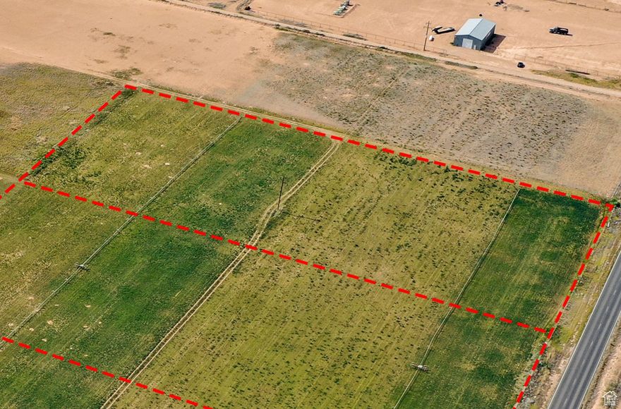 Discover the perfect blend of rural charm and modern opportunity with this 5-acre parcel.. This prime piece of land comes with ample water shares, ensuring your agricultural or residential dreams are well-supported. Whether you envision building your dream home, starting a hobby farm, growing crops, or simply enjoying wide open space and privacy, this land offers unlimited potential. This parcel is currently 8.98 acres on county records. Property has been surveyed & just needs recorded to make this a 5 acre parcel through a lot line adjustment.