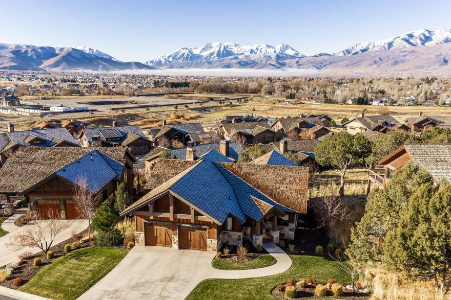 Welcome to 201 N. Kings Peak Court - an elegant retreat in the prestigious Red Ledges community of Heber City. This thoughtfully designed home features a highly desirable main-level floorplan with a comfortable primary suite, a beautifully appointed kitchen, a warm and inviting great room, and a private office.  Enjoy breathtaking views of Mount Timpanogos and the surrounding juniper trees from the great room and back deck-perfect for relaxing or entertaining in a stunning mountain setting.  The lower level offers a spacious family room and two private en-suite bedrooms, ideal for hosting guests. Designed for effortless living, this residence is HOA-maintained, with landscaping and snow removal included-perfect as a full-time residence or lock-and-leave second home.  Ideally located within walking distance to the Village Center amenities-fitness center, resort-style pool, tennis and pickleball courts, and the Golf Park. A rare opportunity to purchase a coveted Red Ledges Golf Membership further elevates this exceptional offering.  Red Ledges encompasses nearly 2,000 acres of spectacular Utah real estate located 20 minutes from Park City. Red Ledges' luxurious amenities include the award-winning Jack Nicklaus Signature Golf Course, the Jim McLean Golf School and practice facility and a Cliff Drysdale Tennis School. Other amenities include a Swim and Fitness Club, resort-style pool and grill, and an equestrian program offering lessons and trail rides. In the winter, Utah's world-renowned powder can be found a short drive away at Deer Valley Resort where members enjoy an exclusive member partnership with Stag Lodge at Deer Valley and The Deer Crest Club at the St. Regis Deer Valley.