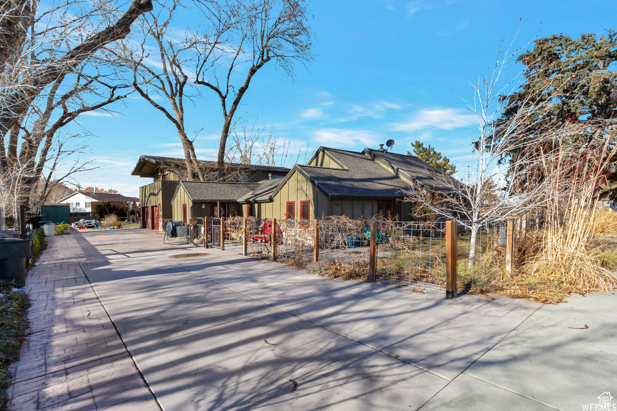 One of a kind property on huge lot in West Jordan. Bright and open modern farmhouse vibe with over 4500 sq ft above grade. Endless possible opportunities. Separate mother in law you could use as home office space, airbnb, or rent to offset mortgage. Home is Wheelchair accessible and offers one level living. Fully fenced with tons of parking, storage, craft room, garden, courtyard, patios and so much more. Must see to appreciate.