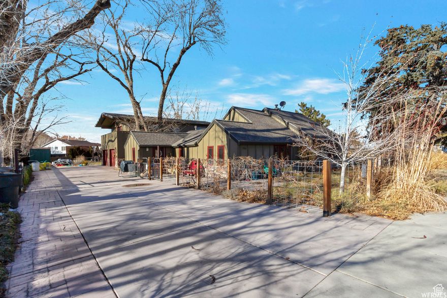 One of a kind property on huge lot in West Jordan. Bright and open modern farmhouse vibe with over 4500 sq ft above grade. Endless possible opportunities. Separate mother in law you could use as home office space, airbnb, or rent to offset mortgage. Home is Wheelchair accessible and offers one level living. Fully fenced with tons of parking, storage, craft room, garden, courtyard, patios and so much more. Must see to appreciate.