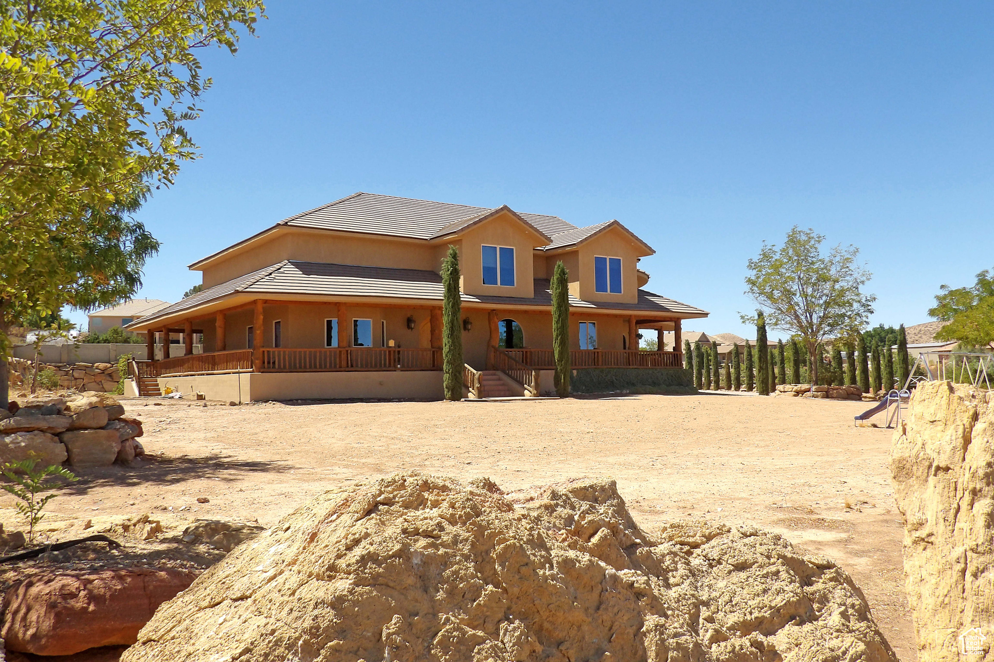 : Incredible Ranch Estate with horse privileges. Entering the home, you're greeted by vast spaces for entertaining, corporate retreats & more. Massive backyard is privately fenced in ''compound'' style & will make a great location for your next big event or just a family get-together. 5-Car ultra-high garage houses an array of toys, geothermal heat is super-efficient & location is superb. Sold AS/IS. All garages are plumbed for an air compressor. The shop Garage is wired for 220 outlets. Heating and Air is 3 Geo-thermal Heat and air pumps, the air is 68 degrees, constant air. The basement is fully enclosed in Concrete, 2'' foam insulation ICF forms inside and out on the main floor, plumbed for a kitchen in the basement, and has a special engineered ceiling over the basement that eliminates any posts or walls in the basement.