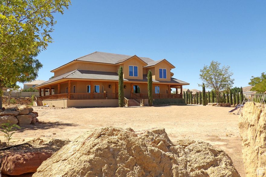 : Incredible Ranch Estate with horse privileges.  Entering the home, you're greeted by vast spaces for entertaining, corporate retreats & more. Massive backyard is privately fenced in ''compound'' style & will make a great location for your next big event or just a family get-together. 5-Car ultra-high garage houses an array of toys, geothermal heat is super-efficient & location is superb.  Sold AS/IS.  All garages are plumbed for an air compressor. The shop Garage is wired for 220 outlets. Heating and Air is 3 Geo-thermal Heat and air pumps, the air is 68 degrees, constant air. The basement is fully enclosed in Concrete, 2'' foam insulation ICF forms inside and out on the main floor, plumbed for a kitchen in the basement, and has a special engineered ceiling over the basement that eliminates any posts or walls in the basement.
