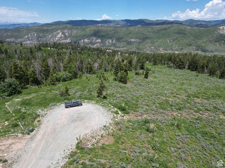 9-acre lot is truly one-of-a-kind, offering one of the most desirable building locations in Soldier Summit. Featuring breathtaking mountain views, expansive open spaces, and a lush, dense forest, this property is an ideal setting for your dream retreat. The flat, open field sits perfectly atop the hill at the end of a quiet cul-de-sac, offering a prime building site with panoramic views. The lush forested area extends downhill, providing privacy and scenic beauty that complements the open space above. An additional benefit is the property's inclusion in the greenbelt program, significantly reducing taxes to under $10 annually. While utilities are not yet connected, they have been conveniently run to the road for ease of installation. Soldier Summit offers gated entry, ensuring your own secluded haven in this stunning mountain community. All information provided is to be verified by the buyer or buyer's agent.