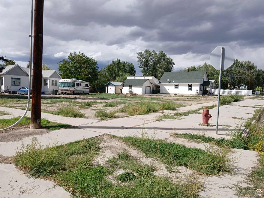 Buyer to verify utility locations and all costs for hookups.    This location would be perfect for a small home or garage.  This 80 x 107 foot  corner lot has access from two directions.  this dual street frontage provides increased visibility and easy access ideal for a single family home with room for a large wraparound porch, side-entry garage, or lush garden landscaping. The county will assign the correct address of the lot.