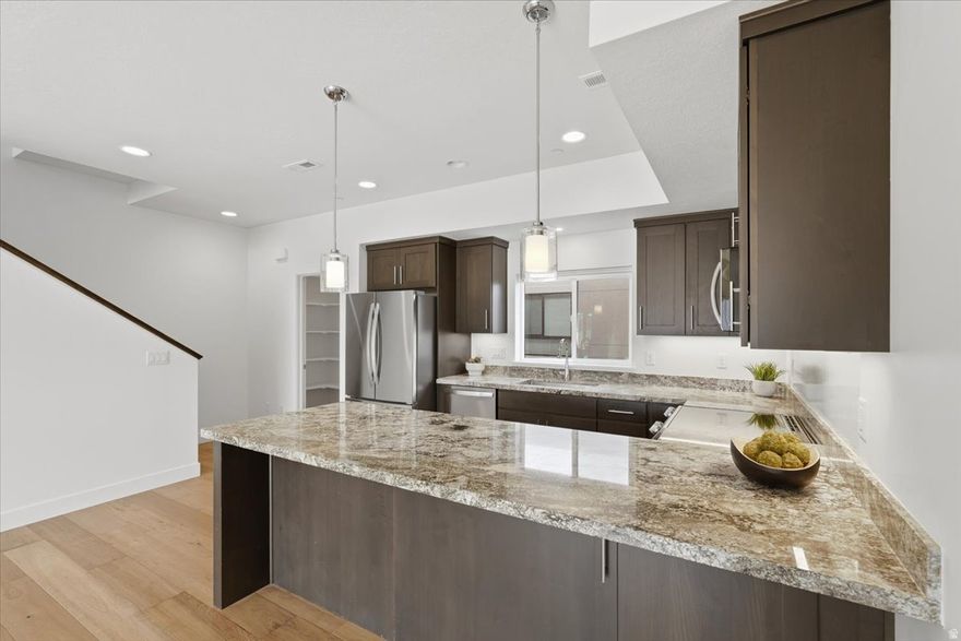 Sleek modern townhome in the heart of Cottonwood Heights! This urban living retreat offers high end finishes, Hard wood floors, natural stone counter tops, open-concept living and abundant natural light. Spacious open concept and dining areas flow to a private balcony with mountain views. Just minutes from world class skiing in Big and Little Cottonwood Canyons and close to Fort Union's shopping, dining, and entertainment. Low-maintenance living with upscale style-perfect for year-round mountain and city life.  Buyer to verify all info. Seller is a licensed agent.  Seller will consider Seller Financing options.