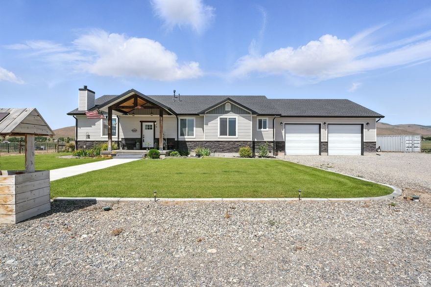 Quality Country Living on 9.86 Acres | Malad, Idaho Escape the busy city life and embrace the peace of country living just outside of Malad. Why build when you can move right into this nearly new, exceptionally well-cared-for home offering over 3,700 sq. ft. of open, thoughtful design. The property combines simplicity and function with quality finishes, including custom cabinetry with dovetail and tongue-and-groove construction, granite countertops, a gas stove, and a cozy wood-burning fireplace. The open floor plan and main-level living make for an inviting, easy-to-manage lifestyle, while high-speed fiber-optic internet ensures reliable remote work. Enjoy gorgeous sunsets from one of two covered decks (8x15 and 16x20), or relax in your fully fenced backyard-perfect for kids, dogs, or chickens. The property is well set up for livestock, featuring fenced pastures, three outbuildings, and 3.25 shares of Samaria Irrigation Water. The nearly finished basement adds extra living potential, complete with a secure room featuring a vault door-ideal for storing valuables, firearms, or collectibles. For buyers wanting more space, an adjacent 9.86-acre parcel with an additional 3.25 water shares is available, offering the opportunity to own nearly 20 acres. The seller is offering $50,000 in buyer concessions for those agreeable to mutually acceptable rent-back terms while their new home is under construction. Just minutes from Malad's grocery stores and amenities, this property offers the best of both worlds-quiet country living with convenient access to town. Schedule your private showing today. Buyer to verify all information.