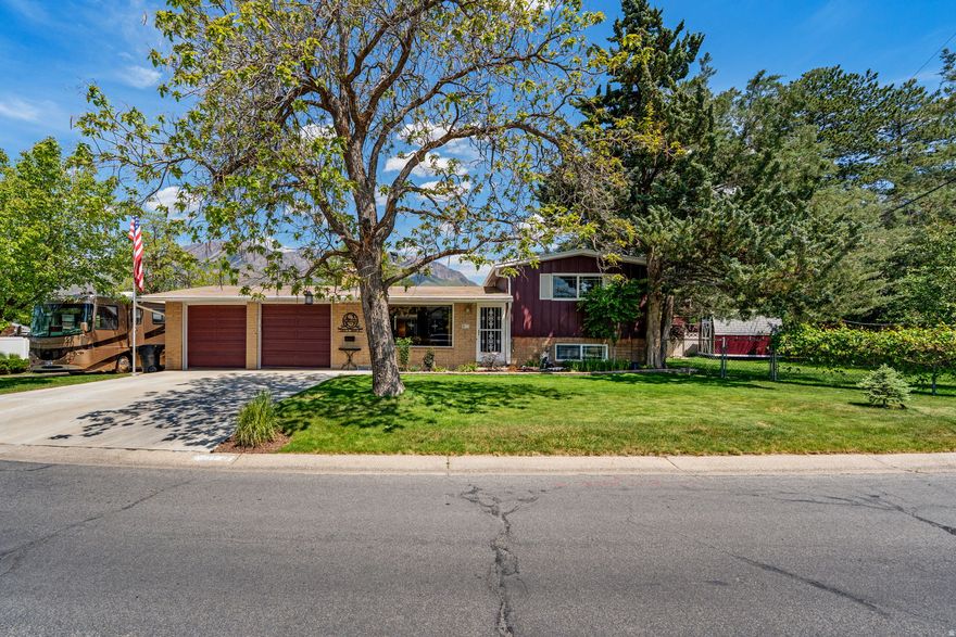 Super Cute Cottonwood Heights home on a corner lot! Views of the Mtns! You are going to love the oversized attached garage, including a 14'x18' wood/workshop equipped with (3) 220V outlets. RV Parking, over 40' long, and there is a 30 amp and a 50 amp electric hookup with access to its own sewer cleanout. Sitting on the back deck, under its own charming cover, surrounded by mature landscaping is a dream. Even at night, the included lighting package creates a private and serene oasis (outdoor furniture can be included) As you walk in the home, you will love the exposed original hardwood flooring. The added can lighting. The brand new bathroom (2024). New high efficiency AC and Furnace (less than three years old). Water Heater (2021) Solid roof (2012). LED lights throughout. The windows have all be replaced! Main water line replaced in 2018. Sewer Line maintained and fully relined in 2019. All kitchen appliances are included. Washer/Dryer included. Kitchen Island Included. Reverse Osmosis (at the kitchen sink) Included. This home features so much for the price. GOOD BONES all around. Well maintained! Amazing location! Don't let this one go!