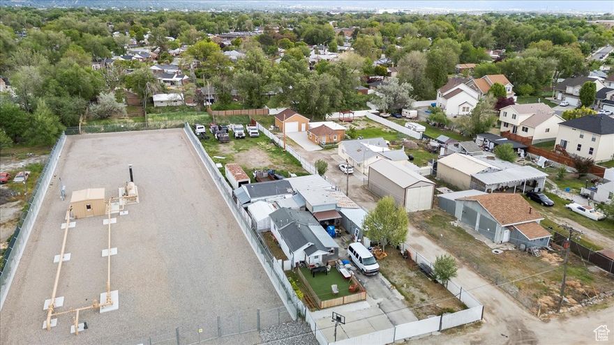Unique Commercial Opportunity Near Downtown!  Unlock the potential of this versatile .44-acre property just minutes from downtown Salt Lake City. Tucked inside a mixed-use neighborhood with convenient freeway access, this property offers a rare combination of land, location, and flexibility.  Sitting at the front of the lot is a 540 sq ft single-family home - ideal for a small business owner/operator, office user, or as a rental income opportunity. The rest of the fully fenced lot provides ample space for parking, equipment storage, or future development. Zoned for commercial use and surrounded by a blend of industrial, residential, and retail businesses, the possibilities here are wide open.  Whether you're looking for a contractor yard, small fleet operation, live/work setup, or long-term investment hold, this one checks all the boxes.  Great visibility , Room to expand or build , Fully gated for security , Utilities already connected ,Downtown views in the background