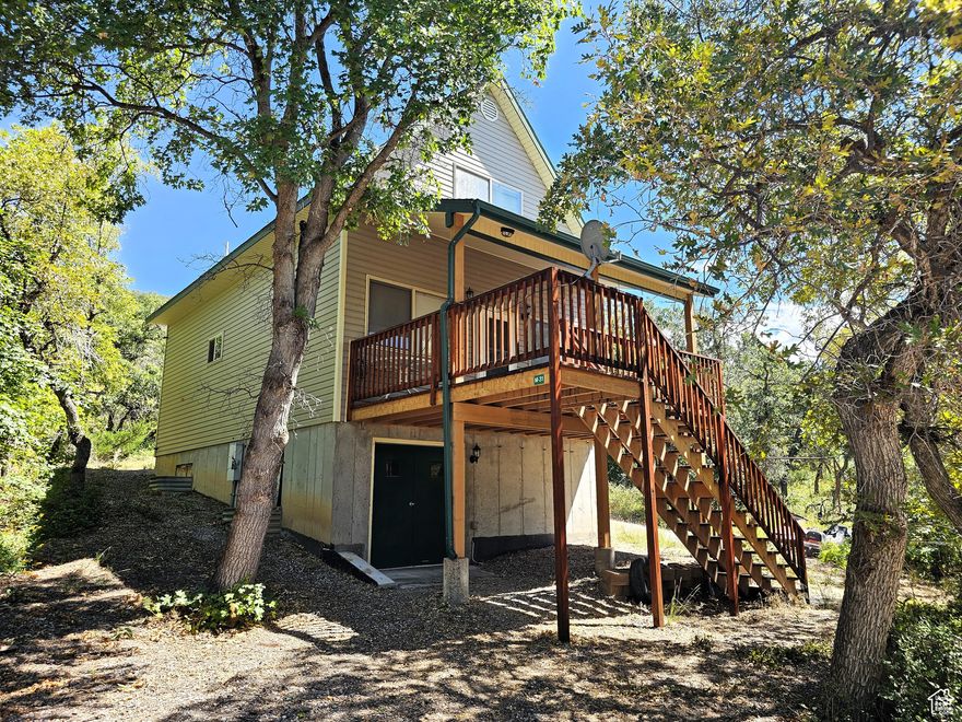 Own your very own cabin on more then an acre of flat usable land. It is the perfect location, easy to get to and less than an hour from Utah County. Sit on the deck and enjoy all that nature has to offer in the mountains as you enjoying the views, evening sunrises, and cool crisp mountain air. The property has open meadow space and tree covered areas. Enjoy the Manti-LaSal National Forest and Skyline Drive; hunting, fishing, hiking, exploring, hundreds of miles of ATV trails and similar terrain for snowmobiles and winter recreation. Just a few minutes from all the small-town amenities like a hospital, hardware and grocery store, community indoor swimming pool, even a drive-in theater. Controlled community gate entrance. Culinary water is from a fill station, water hauling trailer is included. Power is connected. Has a septic system. Winter access is by a tracked vehicle. Elevation is 7,198. MLS map is correct. Google Maps/Earth is 39.61095, -111.38782. Buyer to verify all information. Square footage figures are provided as a courtesy estimate only and were obtained from seller. Buyer is advised to obtain an independent measurement.