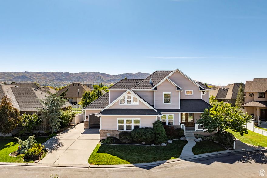 Welcome to the highly sought-after Foxgate Farms community! This stunning property is located near Corner Canyon High School and is conveniently close to a variety of shops and restaurants. Step inside to find a beautifully remodeled basement apartment, previously utilized for short-term rentals, grossing an impressive $2,700 per month from January to September of this year. The main level features an inviting entry with double high ceilings, rich hardwood flooring throughout, and 10-foot ceilings that add to the spacious atmosphere. Fresh paint and new carpet enhance the ambiance, while the gorgeous kitchen boasts granite countertops, a tile backsplash, and stainless steel appliances. You'll also find a formal living room, a cozy family room, and a large dining area, perfect for entertaining. Venture to the upper level, where you will discover 9-foot ceilings, three bedrooms, and an exercise room. The expansive bathroom features double sinks and a tub/shower combo for your convenience. The newly updated basement apartment offers ideal living space for long or short-term rentals, or for multi-generational families seeking separate quarters. It includes LVP flooring throughout, an open concept great room combining kitchen, dining, and family areas. The kitchen showcases quartz countertops, white painted cabinets, and stainless steel appliances. This level also features two spacious bedrooms and a luxurious bathroom with double sinks, a freestanding tub, and a separate shower, as well as a dedicated washer and dryer. Enjoy direct access with a walk-out entrance. The property boasts a large three-car garage with ample storage space. The beautifully landscaped exterior complements a backyard perfect for entertaining, complete with a hot tub. The charming facade features brick along with beautiful cement composite siding, creating great curb appeal. Don't miss your chance to own this exceptional home in a prime location!
