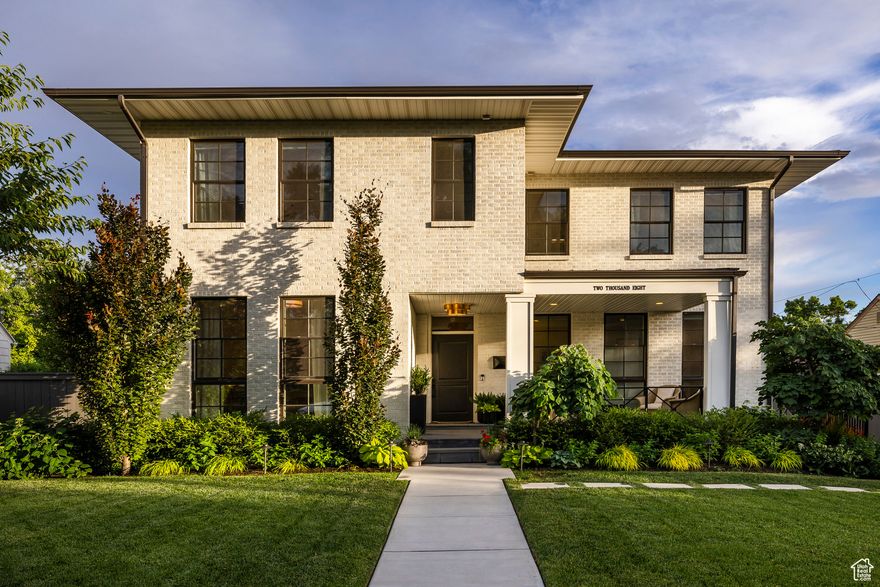 Perfectly designed two-story home in the heart of one of Salt Lake's most desirable neighborhoods. The main floor has an open floor plan.  The gourmet kitchen has quartz counter tops, Thermador appliances, an apron sink and a prep sink, a wine fridge, under under-counter drawer microwave, and quartz counter tops.  The family room space has a fireplace and opens to a spectacular backyard oasis with a new pergola, fire pit, and fountain, and lush landscaping.  Main floor den, mud room, and powder room complete the main floor. The upper level has three bedrooms, including the large primary bedroom with his and hers closets, a separate tub and shower, and double sinks.  The additional two bedrooms have their own bathrooms.  A large laundry room with extra storage completes the upper level. The basement has a cozy family room with a bar for entertaining, two additional bedrooms with large windows for natural light, an additional laundry room, and a 3/4 bathroom. This home has many upgrades, including Pella windows throughout, white solid oak floors on the main floor and upstairs, a Sonos sound system on the main floor, full house humidifier, and an electric driveway gate.  An extra benefit is the new hardy board siding on the two-car garage. You will not want to miss this incredible home!