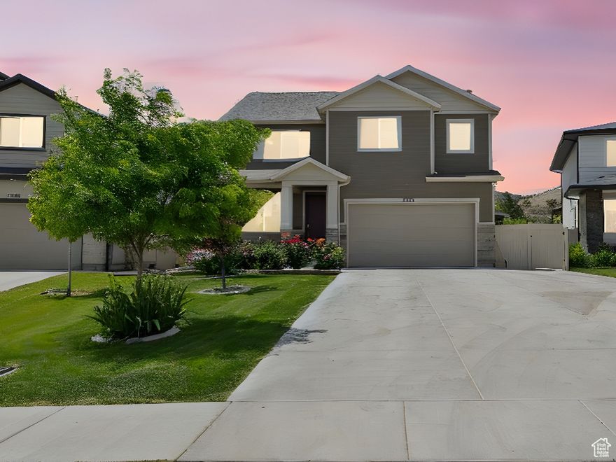 Welcome to this stunning home nestled in the highly sought-after Evans Ranch neighborhood. This well-cared-for home features a 5 bedroom 4 bathroom and complemented accessory dwelling unit. The ADU basement unit includes 2 bedrooms 1 bathroom with separate washer and dryer, kitchen and a private separate entrance.  Beautifully designed kitchen, an open-concept family room, and a spacious dining area perfect for entertaining or everyday living. The 2nd floor offers 3 bedrooms plus multi-purpose loft, full bathroom with quartz countertops and a laundry.  The master suite provides a luxurious retreat with its double vanity, large tub, separate shower, and spacious walk-in closet. The extended driveway allows for extra parking. Outside, the fully landscaped and fenced yard provides both privacy and a stunning backdrop for relaxing or entertaining. This prime location offers convenient access to all that Lehi and Saratoga Springs have to offer.  The Evans Ranch community boasts walking and biking trails, a playground, and a community pool, all reflecting the pride of ownership throughout the neighborhood. Don't miss your opportunity to own this incredible property! This home is truly a gem! Square footage figures are provided as a courtesy estimate only and were obtained from county records.  Buyer is advised to obtain an independent measurement.