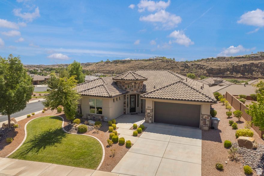 This gorgeous home features 3 bedrooms, 3 full baths, office and stunning upgraded kitchen. Not only is this home located in one of the most convenient locations in greater St George, it also features beautiful bright windows with views in every direction. Some of the upgrades include spacious open floor plan, cabinetry, range hood, built- in oven, Jack and Jill bath, 8ft doors, and lots of storage. This community has direct access to miles of Southern Utah's paved and groomed trails.