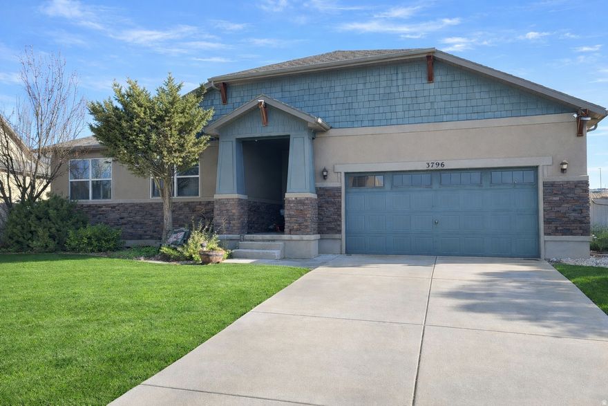 Welcome to this spacious and beautifully maintained rambler located in the sought-after Thanksgiving Meadows community of Lehi. Offering 7 bedrooms, 4 bathrooms, and over 4,300 square feet of finished living space, this home provides exceptional flexibility for entertaining, multi-generational living, or work-from-home needs. The open main level features vaulted ceilings, a bright great room, and a well-appointed kitchen with granite countertops, double ovens, ample cabinetry, and generous dining space. The primary suite includes a walk-in closet and a separate tub and shower. The fully finished basement offers a large family room, additional bedrooms, and versatile spaces ideal for a home gym, office, or media room. Enjoy outdoor living on the fully landscaped and fully fenced 0.216-acre lot with mature trees, mountain views, and a covered patio. The attached 2-car garage offers extra height and depth, plus shelving in the garage is included. Community amenities include a clubhouse, pool, playgrounds, and walking trails. Conveniently located near schools, shopping, and freeway access. Included items are the refrigerator, stove, and garage shelving. Excluded items include curtains, curtain rods, floating shelves in the front room/office, washer, dryer, and microwave.