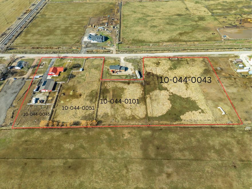 This land listing is tied to a companion residential MLS listing, and both listings must be purchased together as one package totaling approximately 7.14 contiguous acres. The listed price reflects the purchase of all four parcels combined. This listing includes Parcel #10-044-0043 (3.27 acres) and Parcel #10-044-0051 (1.01 acres). The companion MLS#2141813 includes Parcel #10-044-0045, which features a 3,536 sq ft, 6-bedroom, 2-bath home, equestrian barn with indoor horse stalls and concrete floors, large garage, and multiple outbuildings, along with Parcel #10-044-0101 (0.86 acres). Together the four parcels create a rare opportunity for horse property, hobby farming, or country estate living in Weber County. The property includes a well-equipped horse setup with multiple stalls and space for animals, as well as paid-off solar panels and a hot tub at the residence. The additional acreage included in this listing also offers long-term flexibility and potential investment value, as portions of the land may offer the possibility to build or sell off a section in the future, subject to verification and approval by Weber County and applicable city authorities. All four parcels must be purchased together and will close simultaneously. Parcels will not be sold separately. All square footage, acreage, parcel configuration, and property details are provided as a courtesy estimate only. Buyer and buyer's agent to verify all information.