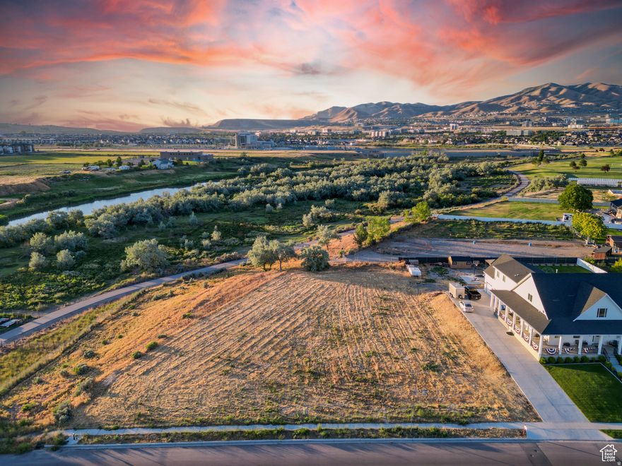 Discover a truly exceptional opportunity to own a nearly 0.7-acre building lot in Lehi, UT. Nestled adjacent to the serene and picturesque Jordan River, this expansive lot offers a unique blend of natural beauty and modern convenience. ------- Located in a coveted area surrounded by high-end, multimillion-dollar homes, this property embodies luxury and exclusivity. Its proximity to the bustling Silicon Slopes makes it an ideal spot for tech professionals and entrepreneurs seeking a tranquil yet accessible retreat. Plus, with downtown Salt Lake City just a short 30-minute drive away, you'll enjoy the perfect balance of suburban peace and urban access. ------- There is no HOA! All utilities are conveniently stubbed to the lot, streamlining the building process for your dream home. The land itself is flat, useable, and boasts incredible views of the Wasatch Range, Jordan River, and mountains to the west. Whether you envision a modern architectural masterpiece or a charming, traditional home, this lot provides the perfect canvas for your vision. ------- This rare find in Lehi not only promises an enviable lifestyle but also the chance to create a legacy home that will be cherished for generations. ------- Seize this rare opportunity to build your dream home in one of Utah's most desirable areas. Please reach out and contact me with any questions. All information within this listing should be considered accurate, but all prospective buyers are encouraged to independently verify any and all information to their satisfaction.