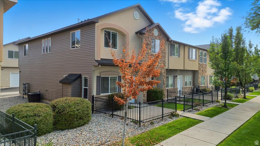 This Isn't Your Run-Of-The-Mill Bridgerland Meadows Townhome!! Thoughtfully remodeled and perfectly maintained Bridgerland Meadows end-unit townhome located just seconds from dining and shopping. Redone kitchen with quartz countertops, stainless appliances (induction cooktop!), newer paint and LVT flooring. You'll find updated paint throughout, NEW water heater, NEW furnace, NEW electric fireplace with added insulation, NEW lighting, under-stairs storage and removable railing for getting furniture upstairs, and much, much more!