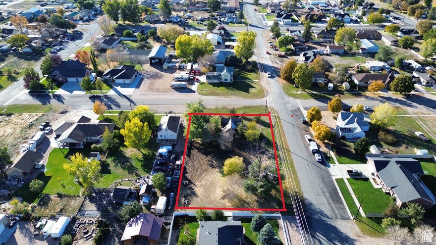 Exceptional investment opportunity in the heart of Nephi City with breathtaking views from every point on this lot. This property features a charming historic brick home that is not on the historic registry and can be torn down. One of the few remaining lots in Nephi City designated for HORSE PROPERTY!! This parcel is zoned R1-8A and offers potential for subdivision into two separate lots (note: subdivision would eliminate horse property qualification, as each lot requires a minimum half-acre). The city is offering some utility incentives, ask the sellers agent about them! Don't miss out on this hidden gem! There is an old cement cellar on the property right next to the home. If the car is not removed by recording date it will stay on the property. Buyer's agent to verify all information. **Please do not access the home on the property due to safety considerations. If any protentional buyers want to see inside the old historic home please contact Kylee Childs to arrange a walk through with the current owners.**