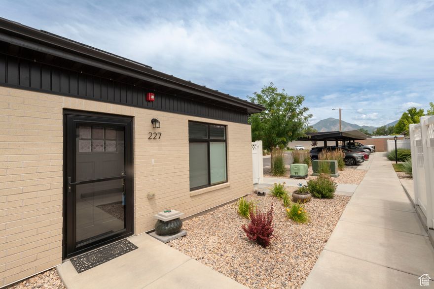 Millcreek's premier 55+ community, nestled in the heart of the Salt Lake Valley. This charming 1-bedroom, 1.5-bath home offers a bright, open-concept layout where the kitchen and family room flow effortlessly into a private outdoor patio-perfect for relaxing. The kitchen features elegant quartzite countertops, a breakfast bar, stainless steel appliances, a spacious pantry, and custom cabinetry, all designed with both style and functionality in mind. An in-unit washer and dryer add everyday convenience, while the home's pristine condition reflects its recent 2021 construction. Assigned covered parking is ideally located near the unit, and just across the street you'll find a stunning swimming pool and an exceptional clubhouse. While pets are not permitted, the HOA adheres to Utah law regarding service animals. This community offers easy access to nearby parks, shopping centers, and major freeways, and is just minutes from year-round outdoor recreation and world-class skiing. Whether you're seeking comfort, convenience, or a vibrant lifestyle, this home delivers it all.