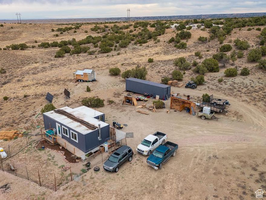 Motivated Seller!  This is a Container Home on 40.54 acres southeast of Duchesne! It is only a year old! Completely off grid!  Includes a septic system, solar power, and generator back up!  1100 gallon water cistern. 1 bedroom, 1 bath. Open Living room/Kitchen/Dining. There is a build on area for storage, studio, shop, or whatever your needs are! This home meets ADA requirements.  Handicap ramp, Accessible placements of appliances and fixtures. A barrier free continuous access throughout the home for individuals with mobility limitations.  Connex is excluded.  The RV and one other tiny home are excluded. This home qualifies for a loan.  Ask us!