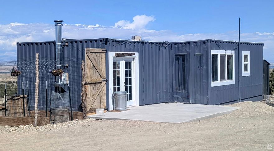 Motivated Seller!  This is a Container Home on 40.54 acres southeast of Duchesne! It is only a year old! Completely off grid!  Includes a septic system, solar power, and generator back up!  1100 gallon water cistern. 1 bedroom, 1 bath. Open Living room/Kitchen/Dining. There is a build on area for storage, studio, shop, or whatever your needs are! This home meets ADA requirements.  Handicap ramp, Accessible placements of appliances and fixtures. A barrier free continuous access throughout the home for individuals with mobility limitations.  Connex is excluded.  The RV and one other tiny home are excluded. This home qualifies for a loan.  Ask us!