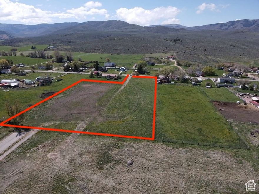 Welcome to this wonderful 4.8-acre property in the highly desirable and rapidly growing Center Creek area of Heber City! This rare piece of land offers flat, fully usable acreage. With direct access from the main road and potential for rear access, it offers excellent flexibility for future development. The property is fully fenced for privacy and security, with stunning mountain views all around.