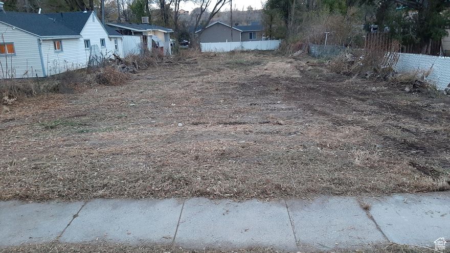 Vacant lot perfect for a modular home or contemporary new construction. 50'X210' , level North facing lot. Awesome location near the Ogden River Parkway Trail, the Utah State University Botanical gardens, the Ogden Rodeo stadium, Lorin Farr park, pool and skate park and the Rainbow Gardens Trailhead