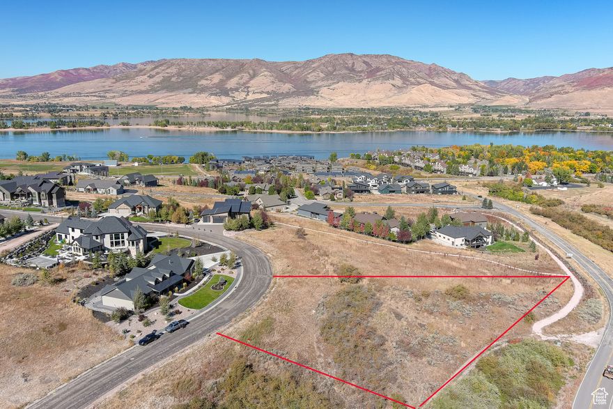 *Location *Location *Location... Located in the beautiful Edgewater Chalet community in the coveted Ogden Valley, Huntsville Utah. This lot is perfect for a primary residence, vacation home or investment property. The lot has amazing lake views as well as Snowbasin Ski resort views, this lot is one of a few lots with all views, water, mountains/valley, and Snowbasin. This lot has a common area on the South and East sides, and the lot has the perfect slope for a walk-out basement, easy to build on unlike most lots in the area. This property is one of the largest lots in the community (.67 ac), and it backs up to Old Snowbasin Road. Only a 40-minute drive from Salt Lake City, this property offers both convenience and access to premier skiing destinations, Snowbasin Resort (2034 Winter Olympic games location), Powder Mountain, and Nordic Valley resorts providing easy access to world-class skiing. Additionally, the valley offers golfing, biking, and hiking trails that are minutes from your doorstep. Pineview Reservoir and Causey Reservoir are close by for boating, kayaking, paddleboarding and fishing. Don't miss this chance, this is a great opportunity to own an amazing lot in Edgewater Chalets subdivision. The Geo Report has been completed, and all utilities are stubbed to the property. Outline of property is for illustration purposes only. *6390 E Hawks Ln. Huntsville, UT