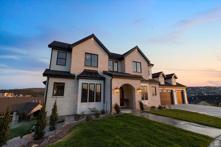 Perched high in the mountains at the end of a peaceful cul-de-sac, this extraordinary estate offers over 7,000 square feet of refined luxury, panoramic mountain views, and unmatched privacy. Thoughtfully designed for both grand entertaining and everyday comfort, this home blends natural beauty with world-class amenities.  From the moment you arrive, the heated driveway welcomes you to a home that's truly above it all-literally and figuratively. Enjoy cleaner air above the inversion and unobstructed views from nearly every room. Step inside to an open and functional floor plan with soaring ceilings, expansive living spaces, and seamless indoor-outdoor flow to multiple decks and patios.  The chef's kitchen is a culinary dream, featuring top-of-the-line Wolf and Sub-Zero appliances, a Cove dishwasher, a large scullery, and even a Scotsman crushed ice maker built into the island. Host with ease thanks to multiple fireplaces, a walkout lower level that feels like a main floor, and a full second kitchen downstairs-perfect for large gatherings or multigenerational living.  Retreat to the elegant primary suite with a cozy fireplace, spa-like bath with a soaking tub and oversized shower, and direct access to the covered deck-where you'll feel like you're in Vail or Park City. A washer/dryer in the primary closet adds unmatched convenience.  Enjoy resort-style living with an in-ground Olympic-sized pool and expansive patio-perfect for swimming, sunbathing, and hosting large gatherings against a breathtaking mountain backdrop.   With high-speed quantum fiber installed, it's ideal for remote work or streaming. Other features include a private gym, a theater room, a roughed in golf simulator, and it is located next to a mountain trailhead for hiking and biking. There is ample storage throughout, and with a half-acre lot offering both seclusion and space-this is mountain living at its finest.