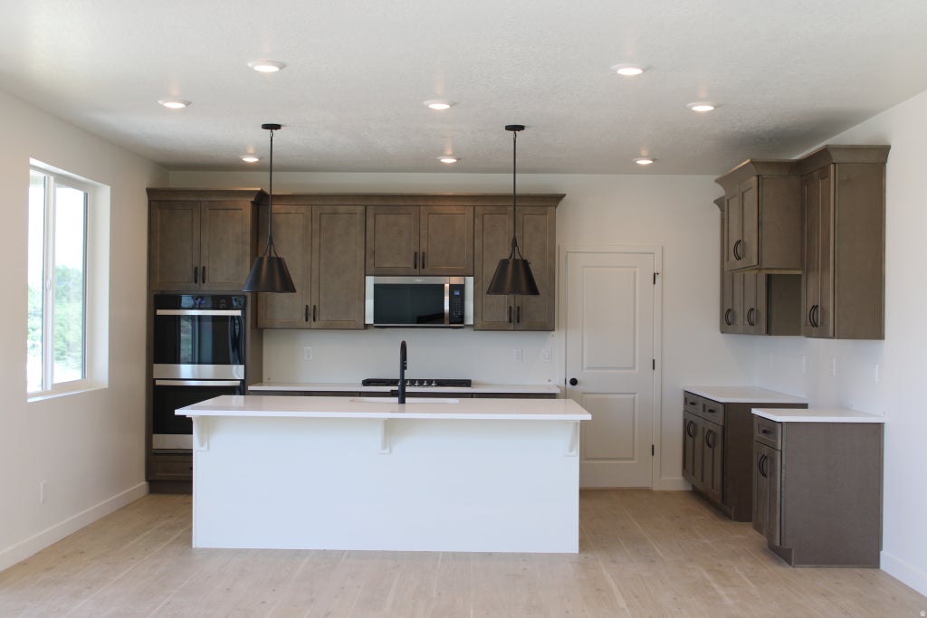 Photo of 6072 W RAVENS ROOST DR #206, Herriman, UT 84096 (MLS # 2167942)