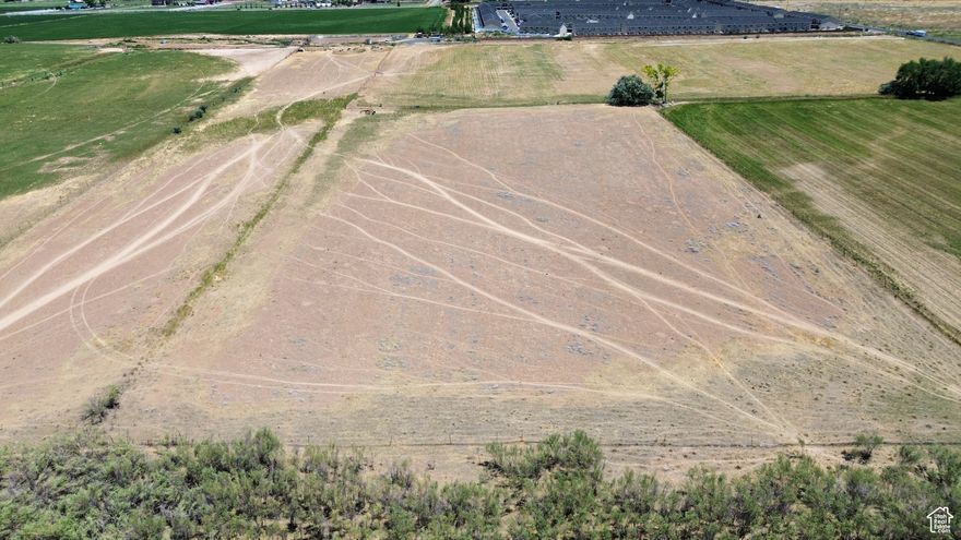 Prime 41.47-Acre Parcel in Cedar City - Ideal for Development  This expansive 41.47-acre parcel of farm land offers an exceptional opportunity for development in one of Cedar City's most desirable locations. Perfectly situated near schools, shopping centers, and recreational amenities, this land provides unparalleled access to the conveniences of urban living while still maintaining a peaceful, rural feel.  Whether you're considering residential housing, commercial spaces, or mixed-use development, this property's location and size make it an ideal candidate for a variety of projects. Cedar City's growth and demand for new development continue to rise, making this a strategic investment for forward-thinking developers.