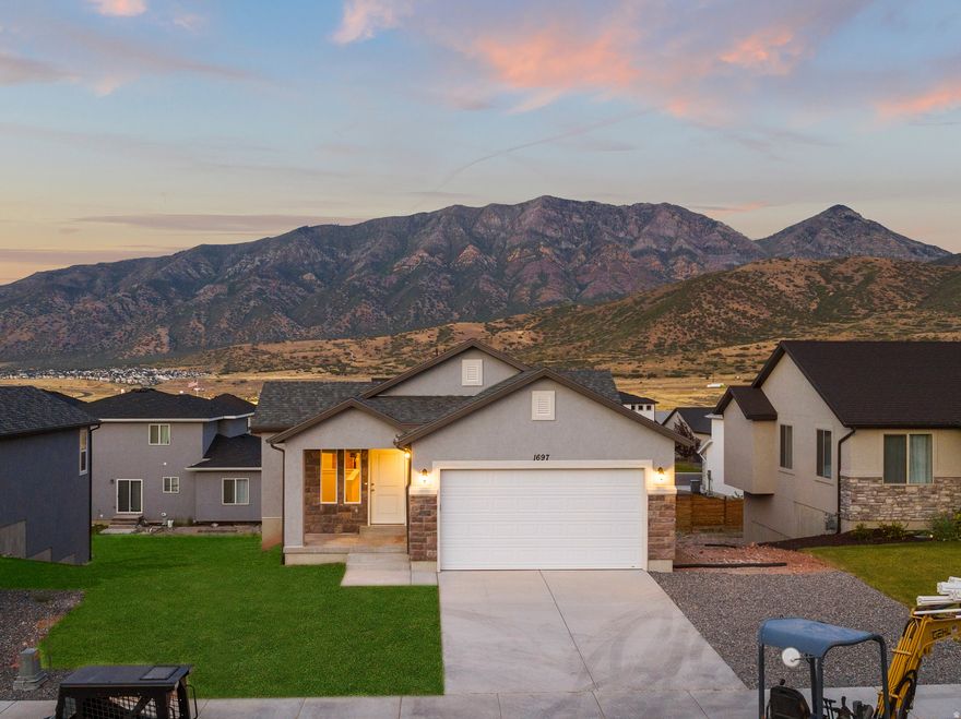 The "Logan" is an incredible floor plan! Amazing neighborhood with stunning views of the mountains at the The Hills community. We can finish building this home in 6 months and likely build this model on any available lot in this community. $10K in closing costs with the builder's preferred lender! Rates, home and lot details are subject to change. Call/text today for more info about this or any of the 30+ models that we can build you at this one-of-a-kind Santaquin community!