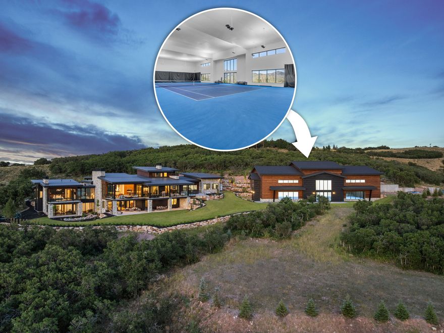 Perched on 24.68 acres in the gated Ranches at the Preserve-one of Park City's most private and expansive neighborhoods-this newly built estate, including a separate structure with indoor tennis court, is a rare combination of seclusion, sophistication, and proximity to everything Park City has to offer. Surrounded by untouched nature, yet only 10 minutes to Kimball Junction and just 25 minutes to Historic Main Street, this legacy property offers the best of both privacy and convenience. Crafted for luxurious main-level living, the 10,954-square-foot residence showcases striking architectural design and refined craftsmanship throughout, from custom cabinetry and woodwork to curated designer lighting and finishes. An expansive great room with vaulted ceilings and a wall of glass that opens at the push of a button invites the outdoors in, framing panoramic views of the Wasatch Mountains and ski resorts. Multiple outdoor living spaces provide unforgettable backdrops for entertaining or relaxation. At the heart of the home is a stunning chef's kitchen, designed with both form and function in mind. Two oversized islands provide ample space for cooking and gathering, while a fully equipped butler's pantry ensures seamless entertaining and storage. The primary suite is a private sanctuary with spa-caliber amenities, generous closet space, and private terrace access. For focus and productivity, enjoy a private executive office and a fully equipped conference room, also ideal as a second office, both enhanced by expansive mountain views and situated in a private wing inside the house. Additional features include a dedicated exercise room, multiple gathering spaces, and a custom bunk room with eight built-in beds, creating a luxurious yet practical retreat for guests or family. The showpiece of the property is the 8,907-square-foot indoor sports facility, designed to meet USTA specifications for tennis, with the versatility to accommodate a basketball court or four pickleball courts. Beyond sport, this one- of-a-kind space offers endless possibilities: transform it into a world-class car gallery, private event venue, music and film studio, or a health and wellness retreat with room for a full gym, lap pool, and golf simulator. For outdoor enthusiasts, take advantage of direct access to the Glenwild trail system from your backyard for miles of hiking, biking, and year-round outdoor adventure. For equestrian lovers, there is a large fully irrigated pasture, and the foundation for a stable has already been poured and plans approved by the HOA and county. Wildlife roam freely around the estate, enhancing its sense of escape, while everyday conveniences remain close at hand. Skiers will appreciate being within 20 minutes of Park City Mountain, Deer Valley, and only 10 minutes from Woodward resorts. 5 minutes from the private Glenwild Golf Club-Park City's premier country club offering world-class golf, dining, and amenities-and only 30 minutes from Salt Lake City International Airport and the vibrant downtown Salt Lake City.