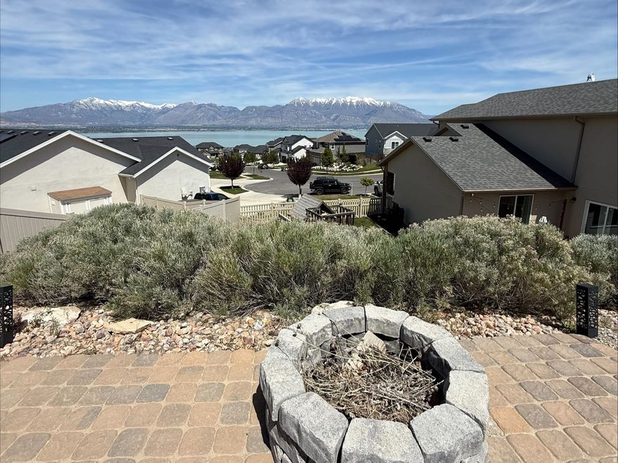 Gorgeous home in quiet neighborhood. *BEAUTIFUL LAKE AND MOUNTAIN VIEWS!* Extra-large lot with no backyard neighbors! This single-family, 2 story home has amazing views of both the Wasatch Mountain and Utah Lake. This home also boasts a massive owner's suite with a sitting area and walk-in closet, a large kitchen and dining space with a walk-in pantry, and a large backyard, with a patio, playground, plenty of grass, and a second level with a fire pit. This home is move-in ready, with storage throughout, and perfect for someone looking for those great Utah views.